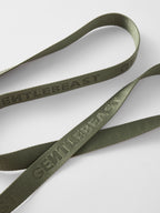 Hands-free dog leash by GENTLEBEAST in use, featuring adjustable strap and comfortable handle with a dog running beside.