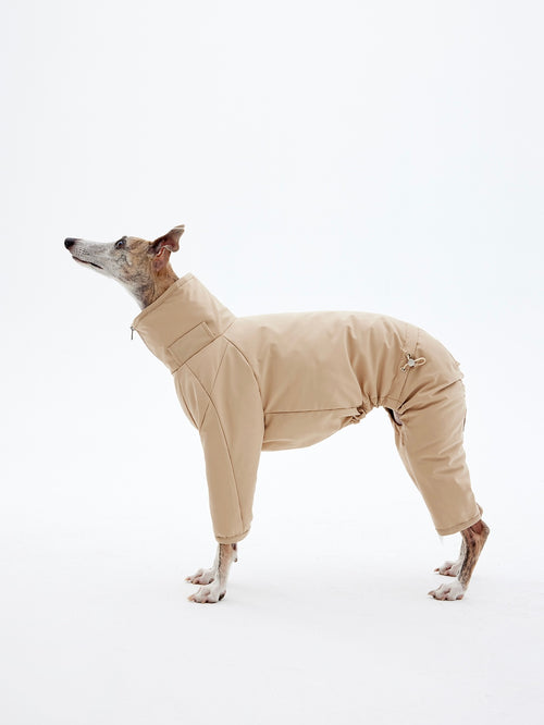 KNOWZA dog puffer suit in navy blue, featuring a cozy design with a hood and reflective detailing for warmth and visibility.