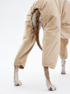 KNOWZA dog puffer suit in navy blue, designed for warmth with a cozy, quilted exterior and adjustable straps.