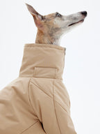 KNOWZA dog puffer suit in bright color, showcasing puffy insulation and a secure fit for cold weather protection.