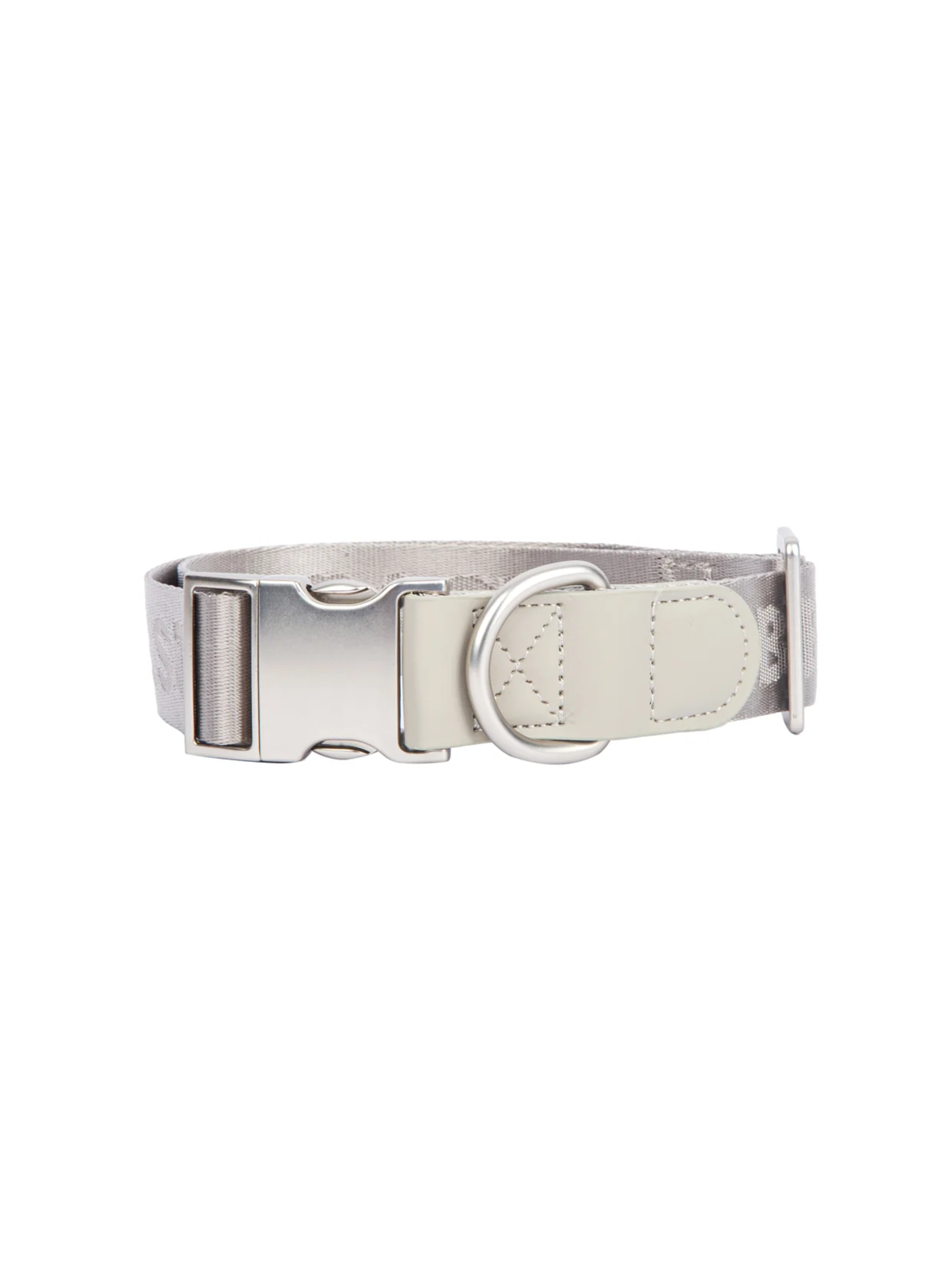 GENTLEBEAST silver dog collar displayed on a soft surface with a shiny finish and adjustable buckle detail.