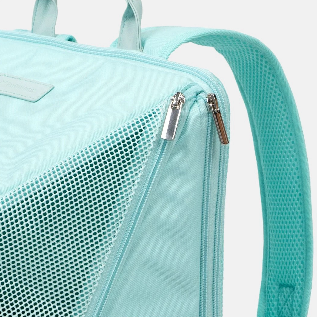 Light blue backpack with mesh side pocket and zippers on a white background