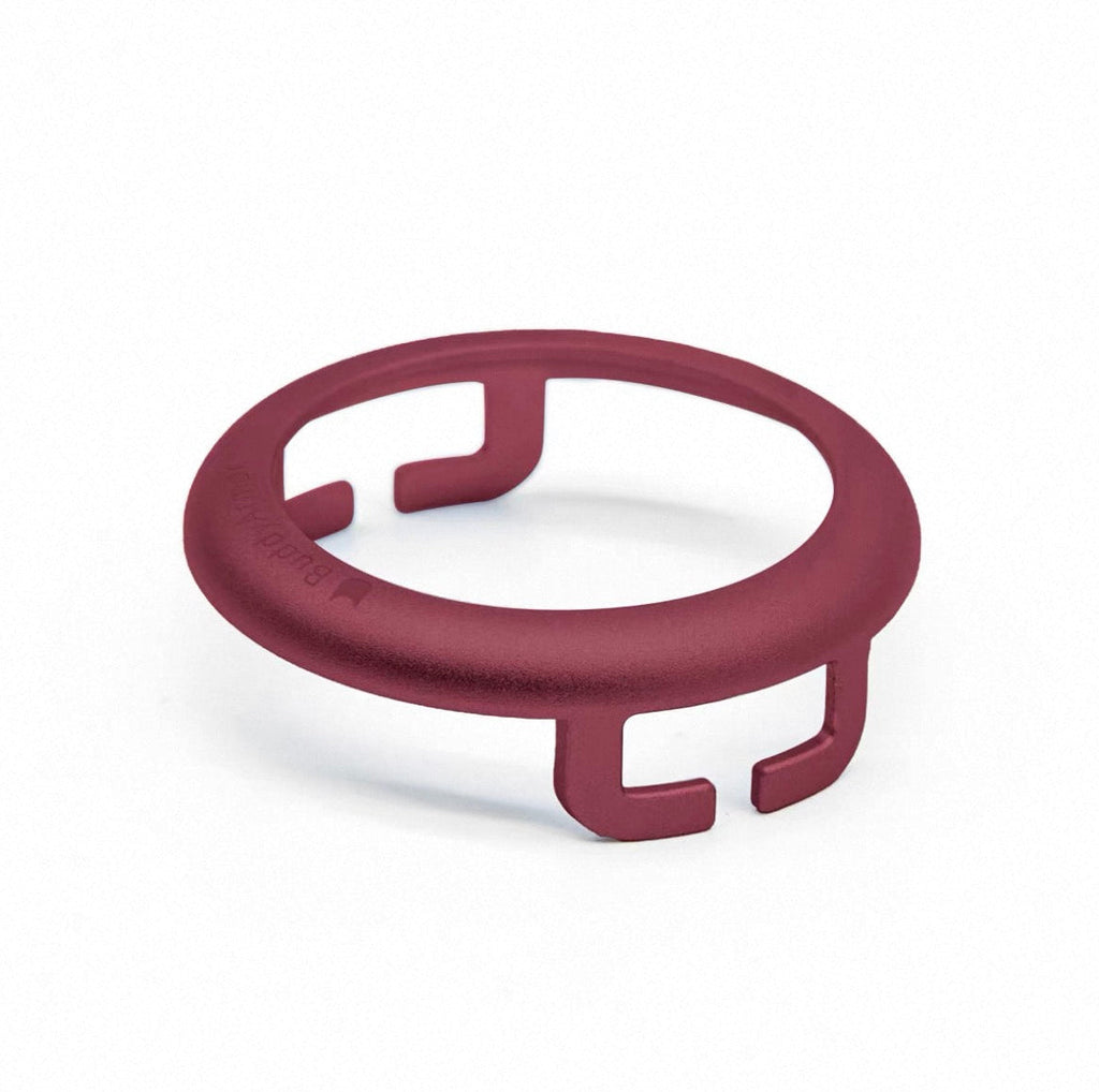 Red circular object with a U-shaped design on a white background