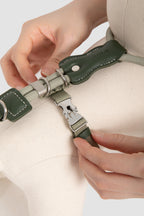 Close-up of the adjustable back slider and metal buckle on a cat harness, showing how the length can be adjusted to fit different cat body shapes.