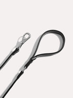 Adjustable dog leash handle with polished metal clasp and reinforced leather stitching.