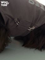 Close-up detail of the adjustable drawstring hem on a graphic dog vest, designed to fine-tune fit and length for different body shapes.