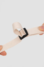 Detail of the adjustable webbing loop on a martingale dog collar, allowing precise neck size adjustment.