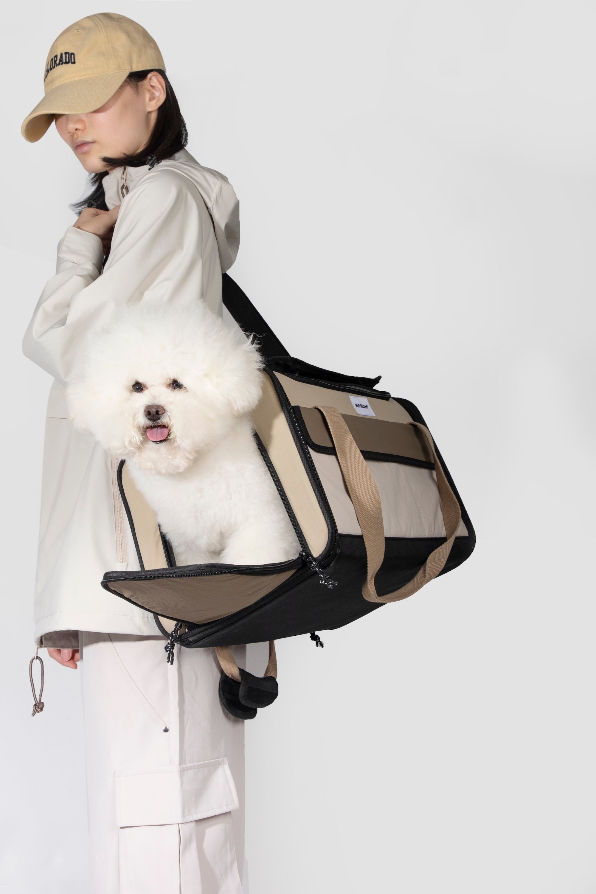 Side view of an airline approved pet carrier worn crossbody, highlighting balanced proportions and shoulder strap support.