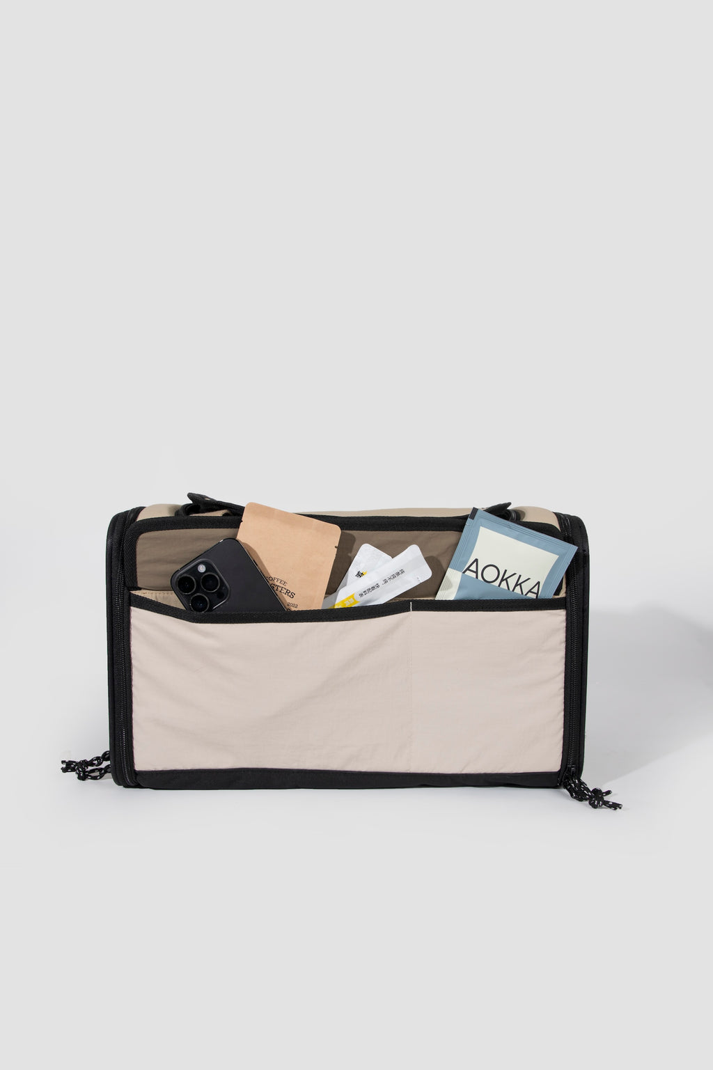 Front pocket of an airline pet carrier showing space for a phone and small essentials during daily outings or travel.