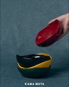 Bean-shaped ceramic pet bowls with smooth underglaze finish, designed for easy stacking and everyday pet feeding.