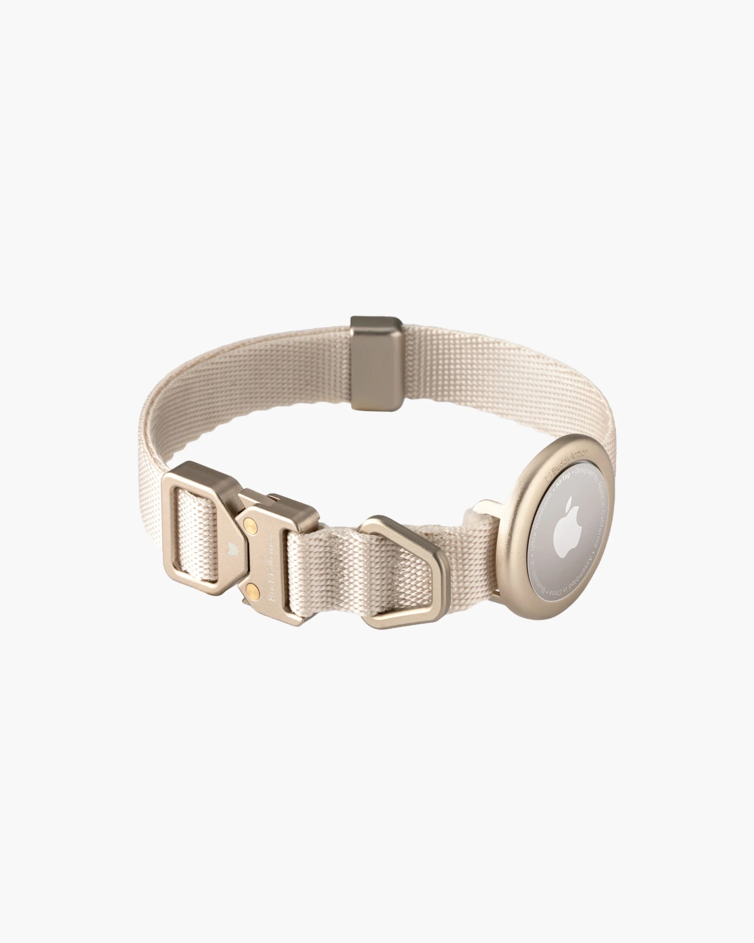 Beige dog collar with metal buckle, adjustable strap, and circular AirTag holder