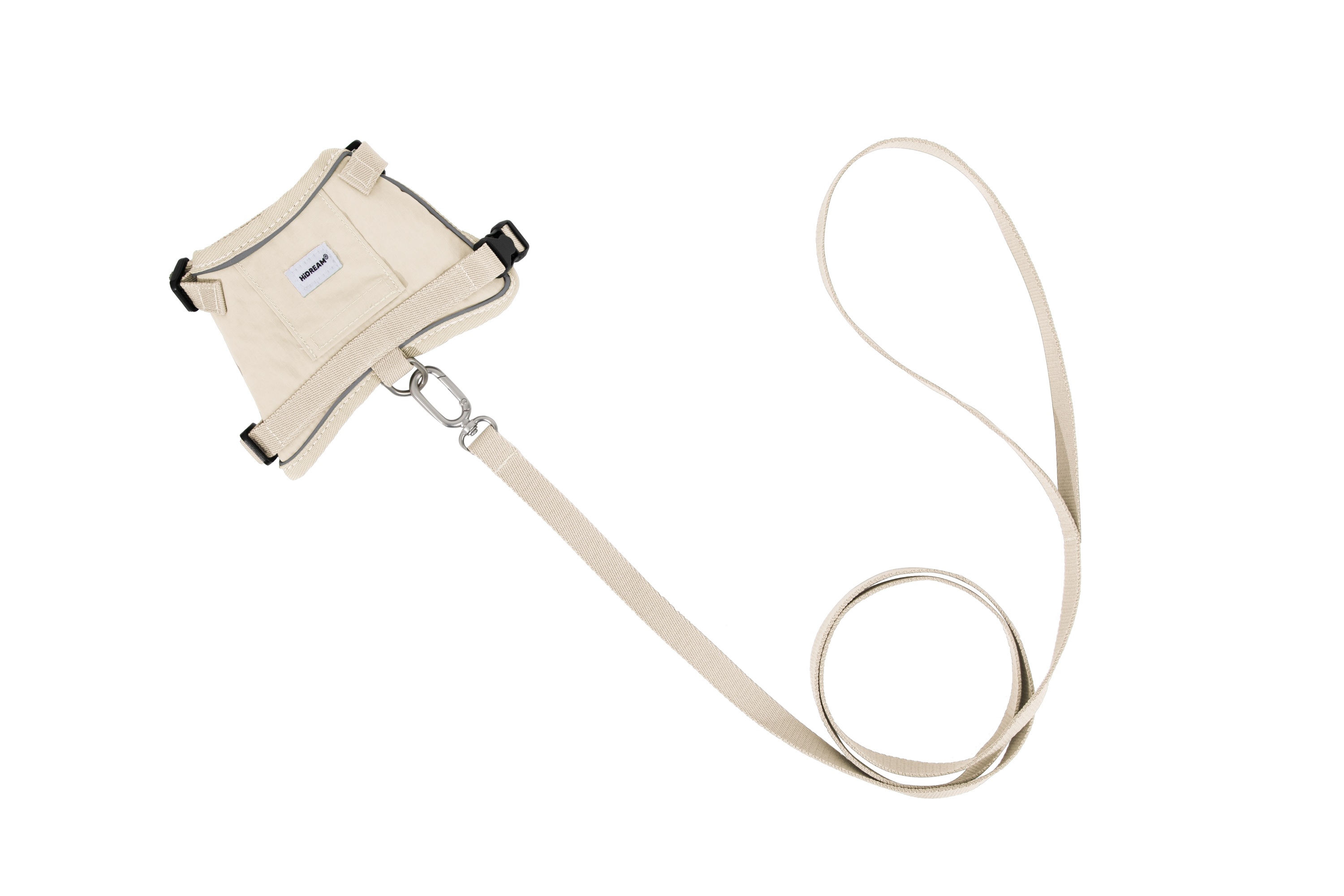 Flat lay of a beige cat harness and matching beige leash on a white background, with the metal connector clearly visible.
