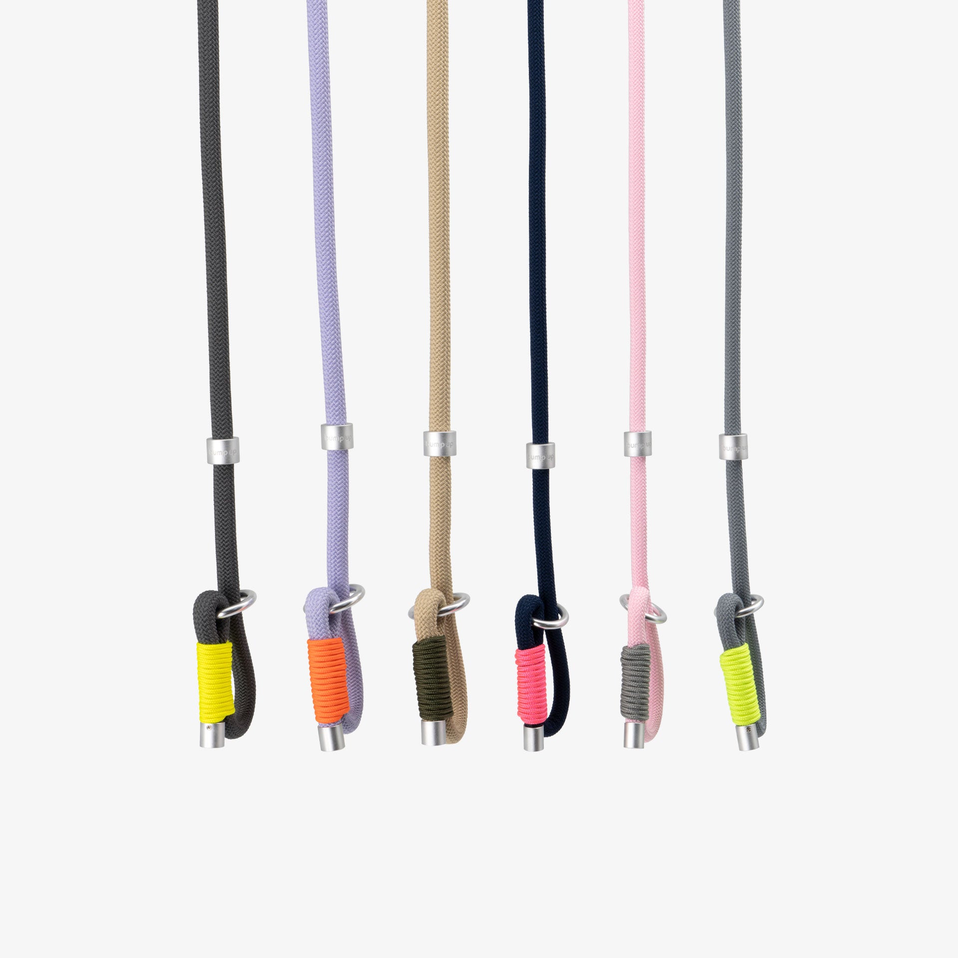 Braided rope dog leashes displayed in multiple color combinations, highlighting minimalist design and aluminum hardware details.