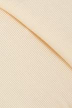 Macro texture shot of breathable stretch fabric used for a cat recovery suit, highlighting soft knit material for long wear comfort.