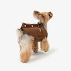 Back view of a brown insulated dog vest with clean lines and evenly spaced snap button detailing.