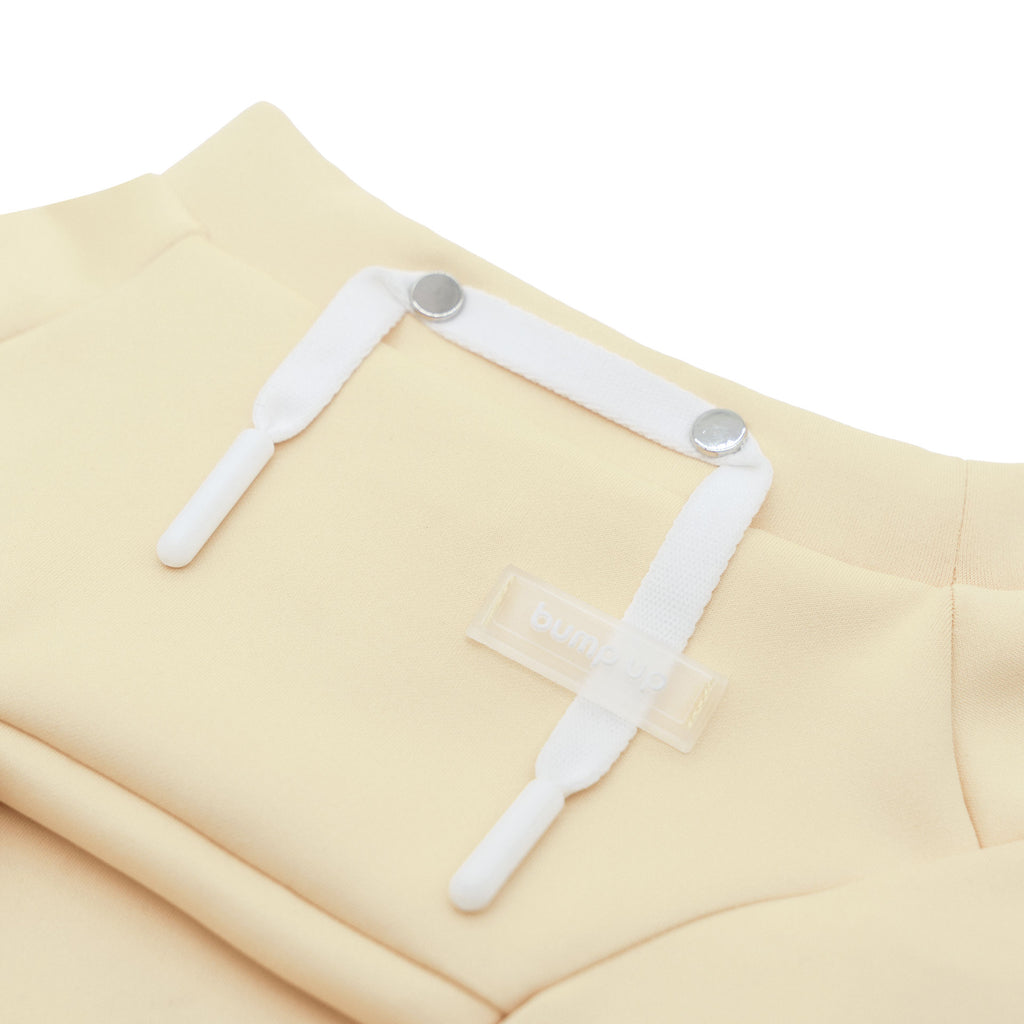 butter yellow dog crop top on a white background