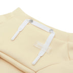 butter yellow dog crop top on a white background