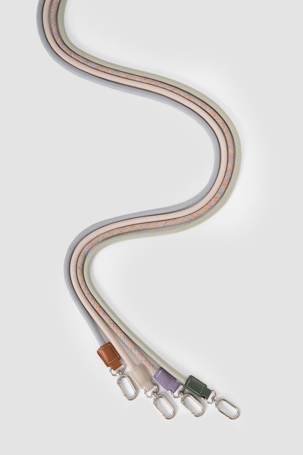 Curved display of cat harness leash ropes in multiple color options, showing braided rope texture and lightweight design.