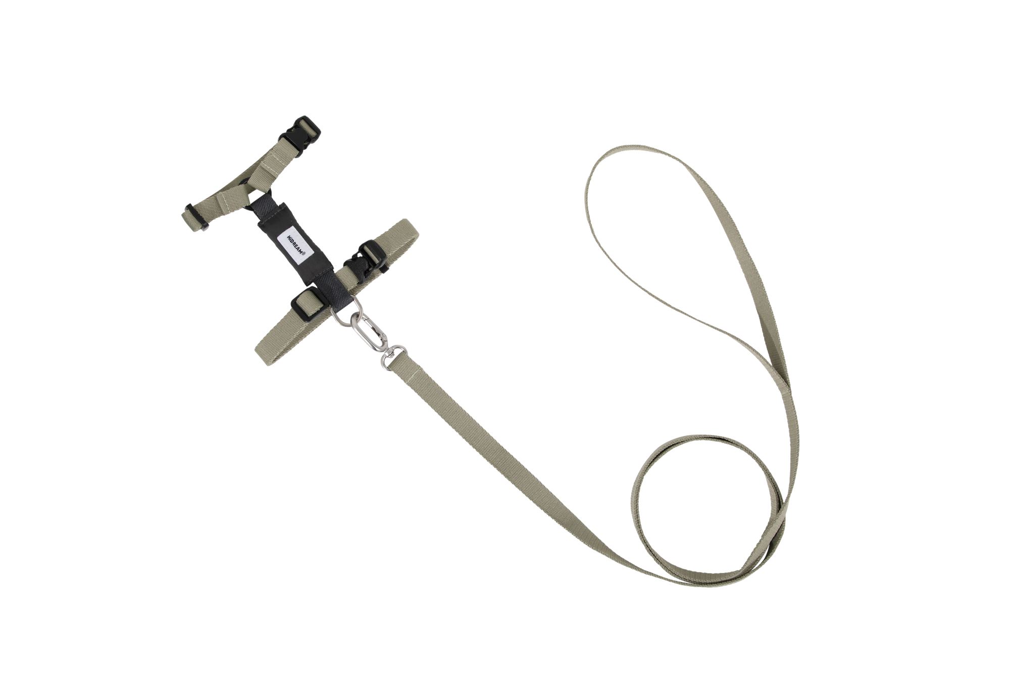 Flat lay of cat harness and leash set in dark color, showing H-style structure, adjustable straps, and integrated leash connection.