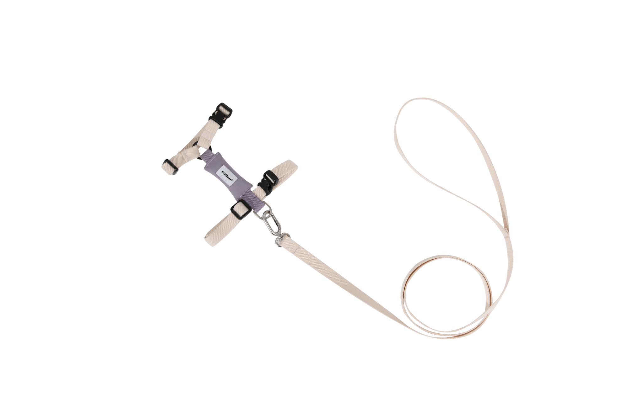 Flat lay of lightweight cat harness and leash set in light color, highlighting minimalist design and adjustable fit for daily walks.
