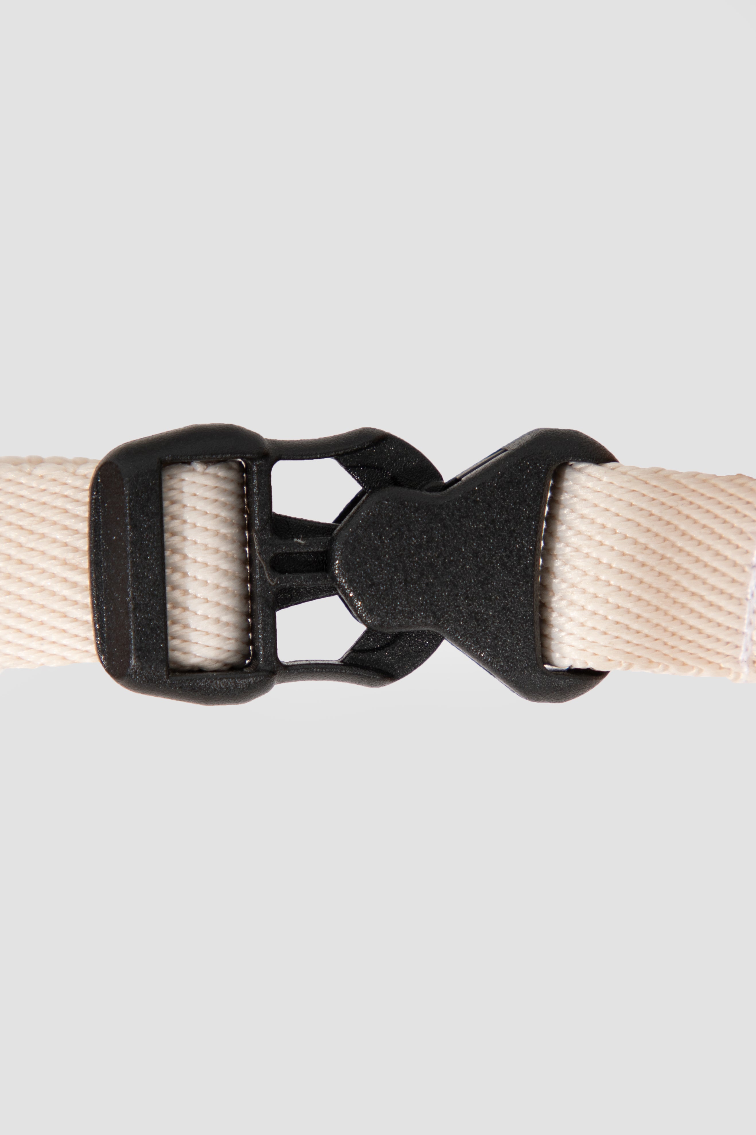 Close-up of POM quick-release buckle on cat harness, showing secure locking structure and smooth snap-on design for easy wearing.