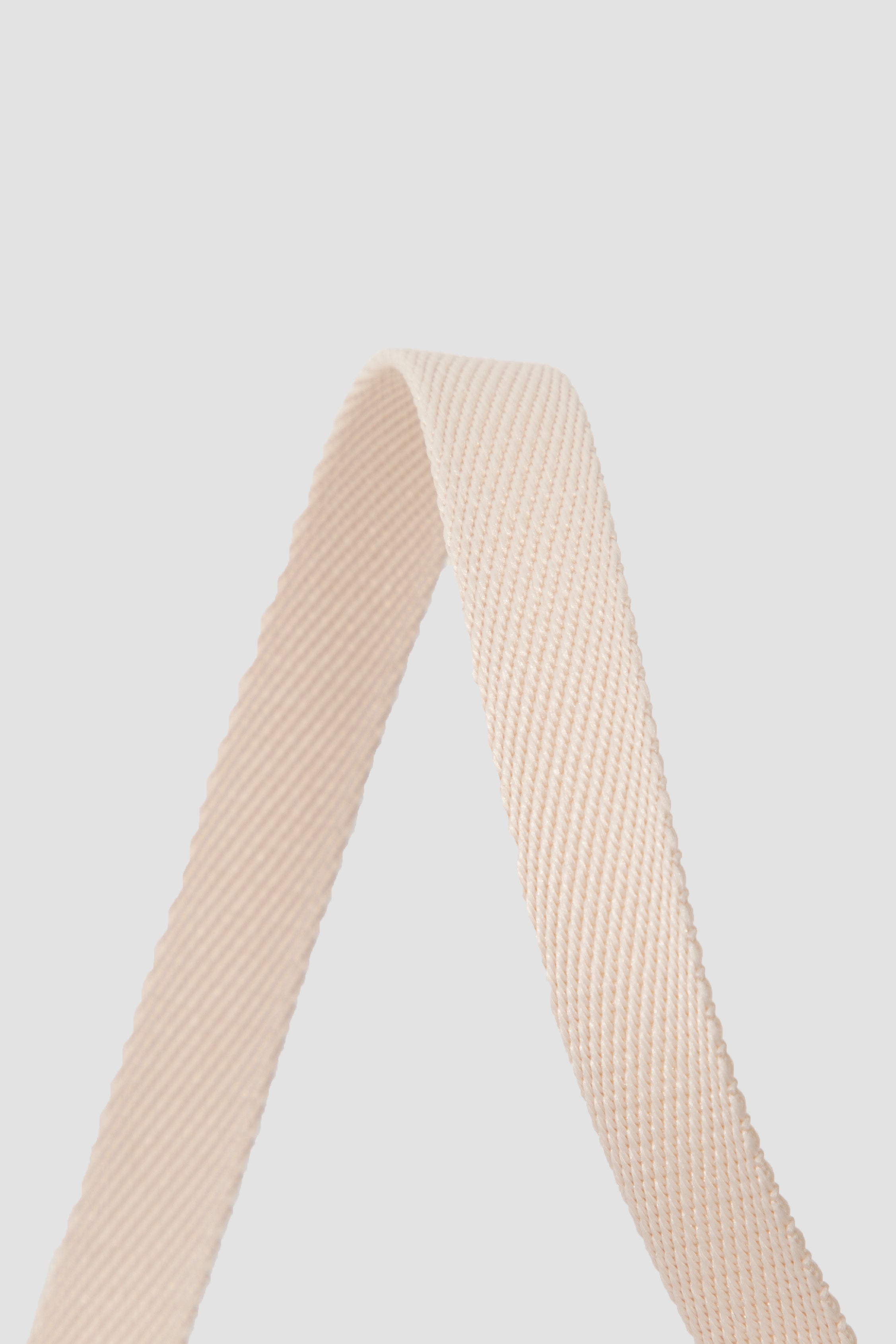 Close-up of soft woven polyester webbing used in cat harness, designed to be lightweight, flexible, and comfortable against fur.
