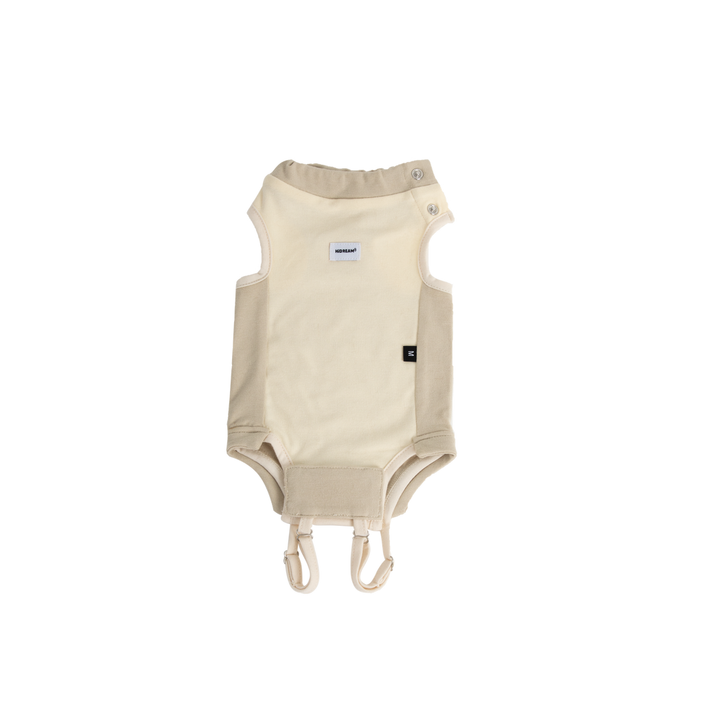 Cream cat surgical suit laid flat on a transparent background, showing breathable recovery bodysuit design with tail opening and secure closures.