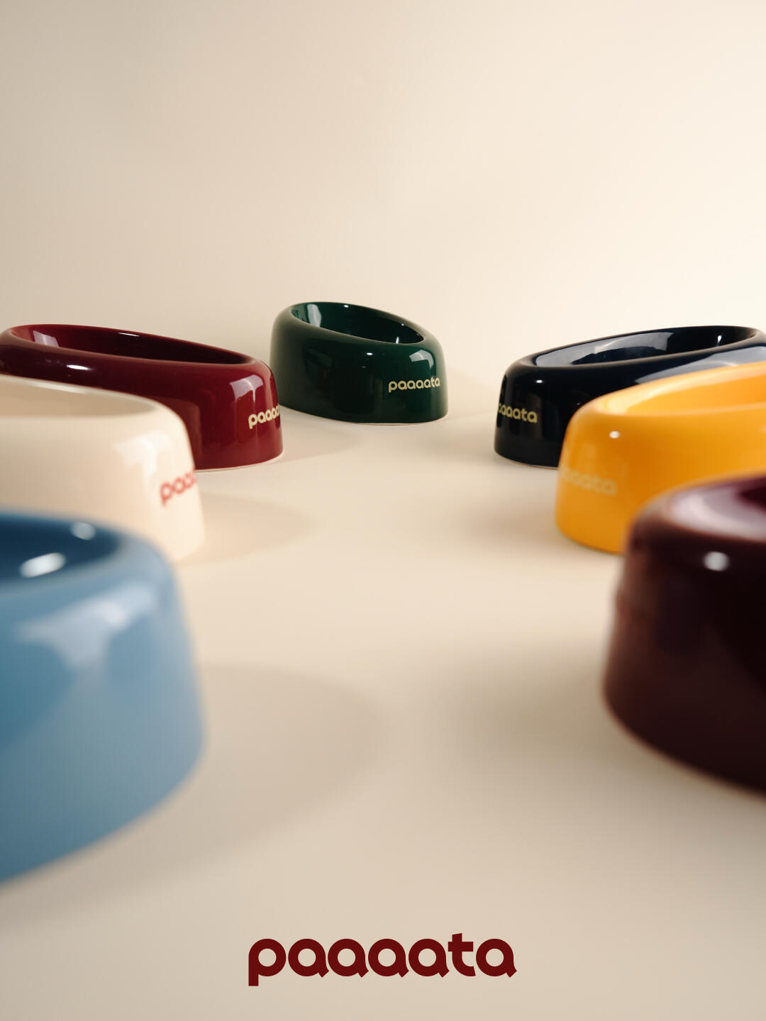 Collection of glazed ceramic tilted dog bowls in various colors designed for long-eared dog breeds