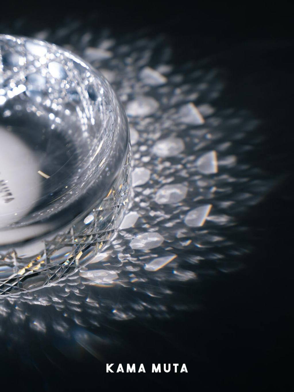 Light refraction patterns created by a cut crystal pet bowl, highlighting the clarity and brilliance of crystal