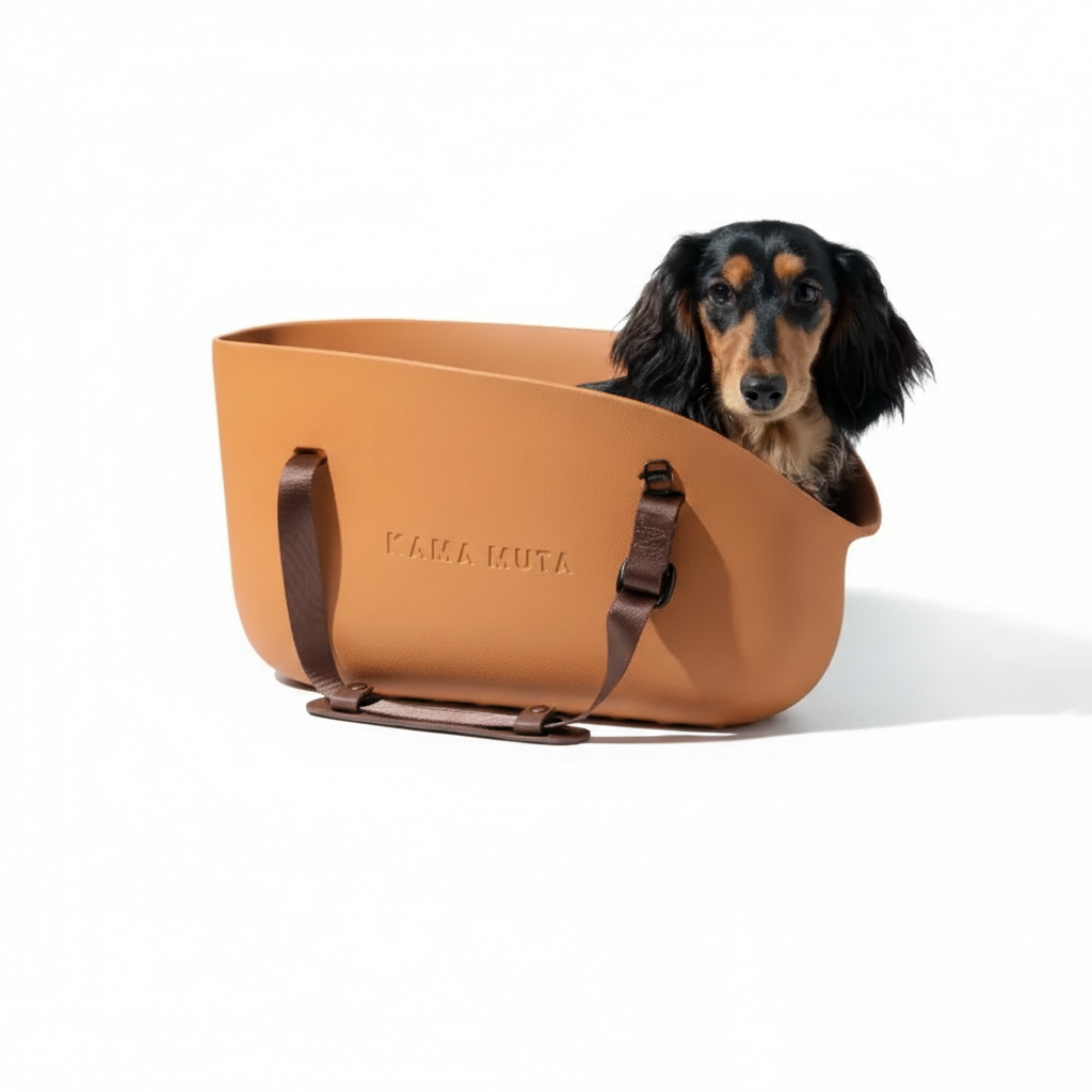 Orange KAMA MUTA pet tote carrier bag with a dachshund inside, showcasing a spacious and comfortable design for small pets.