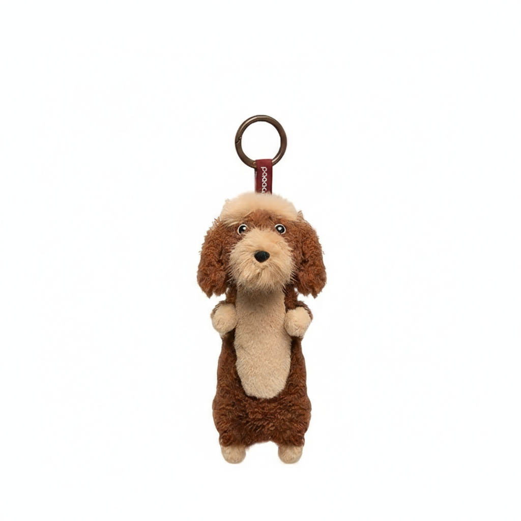Brown long-haired Dachshund plush keychain from paaaata with detailed dog design and attached keyring.