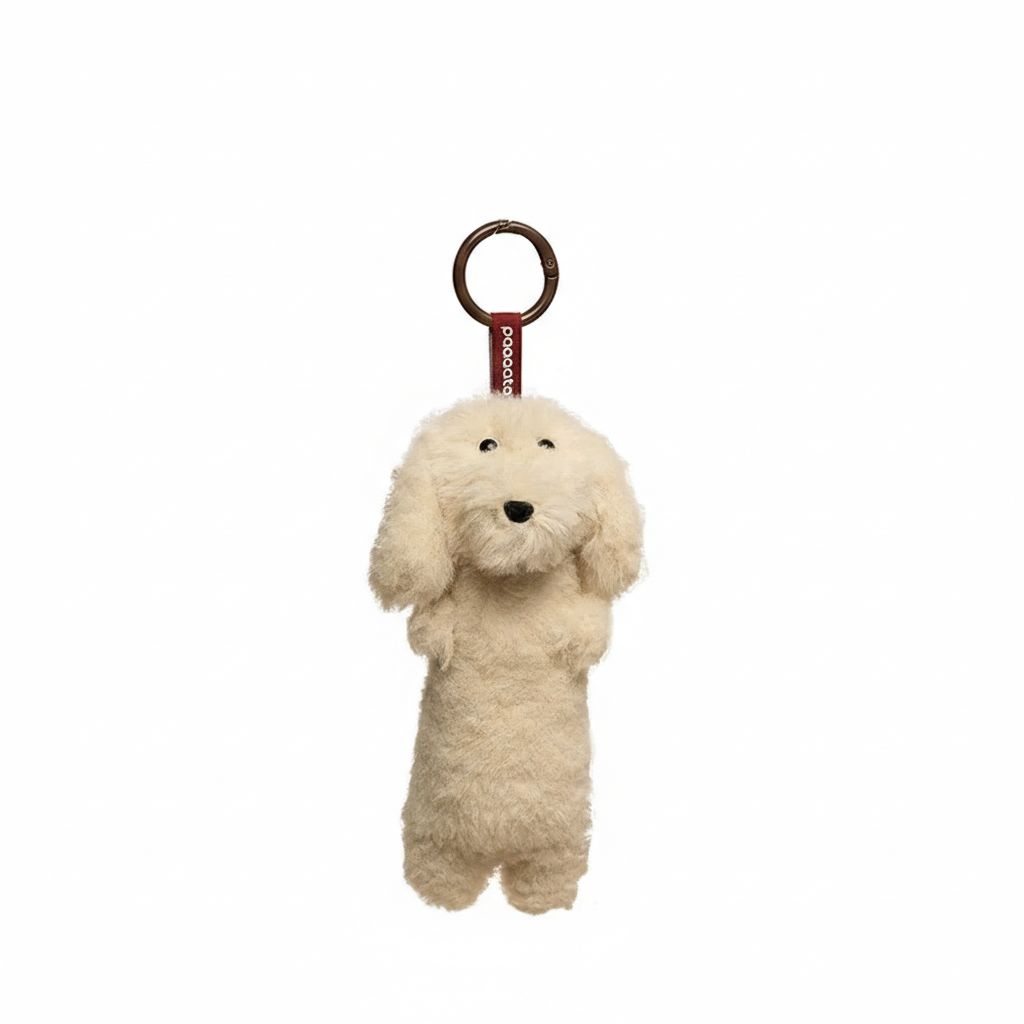 Cream white long-haired Dachshund plush keychain by paaaata with detailed features, perfect for attaching to keys or bags.