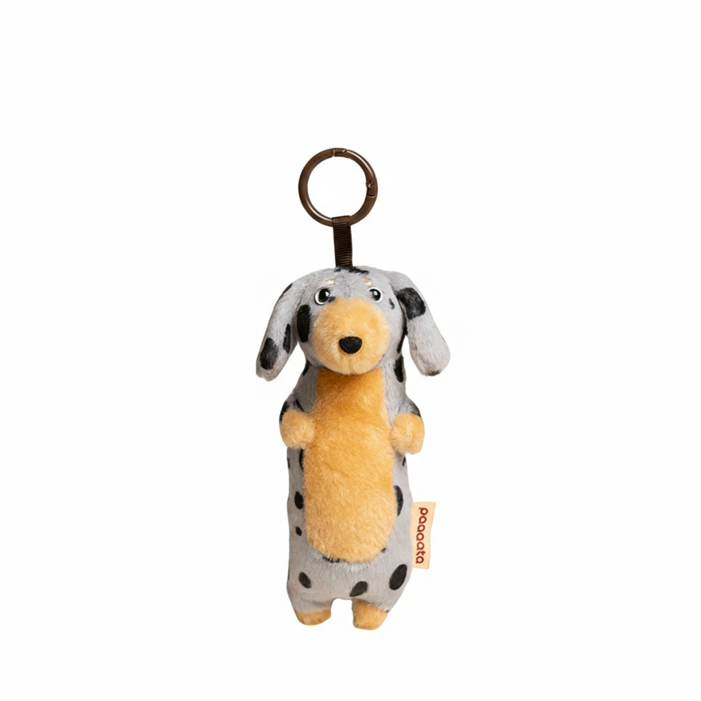 Soft gray plush Dachshund keychain from paaaata featuring a long-haired design, perfect for attaching to keys or bags.