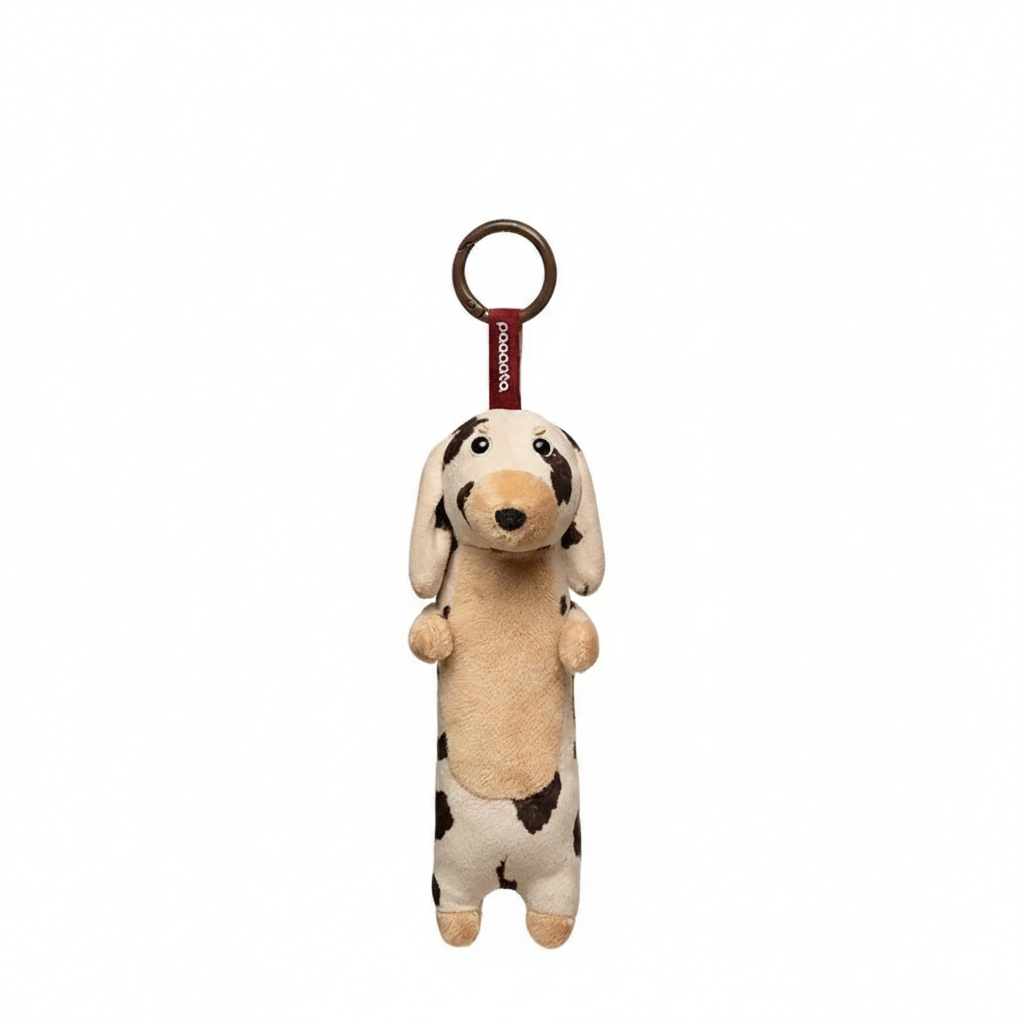 Soft plush dachshund keychain by paaaata featuring a white short-haired dog design on a keyring.
