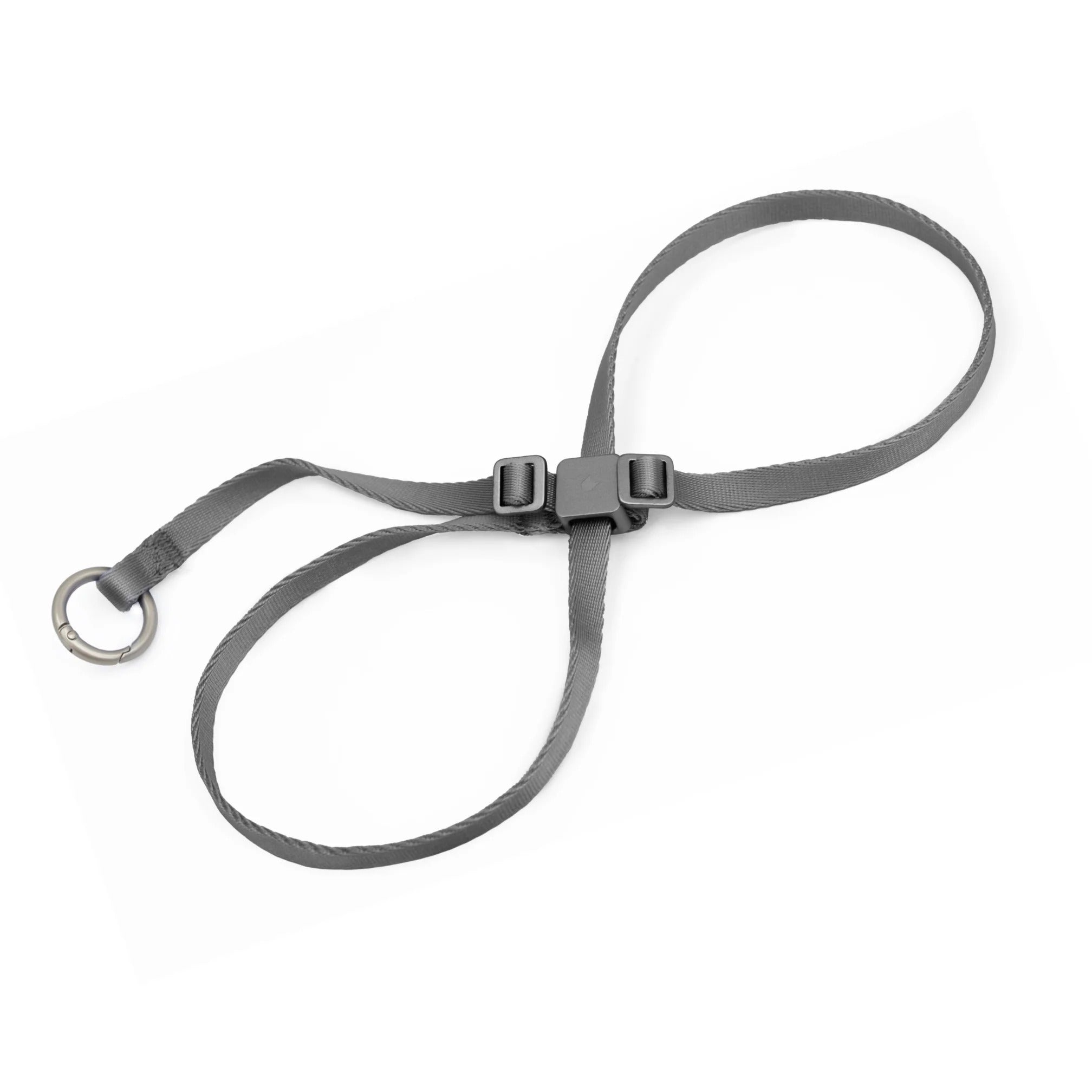 Dark gray cat harness with adjustable straps and open ring design on white background