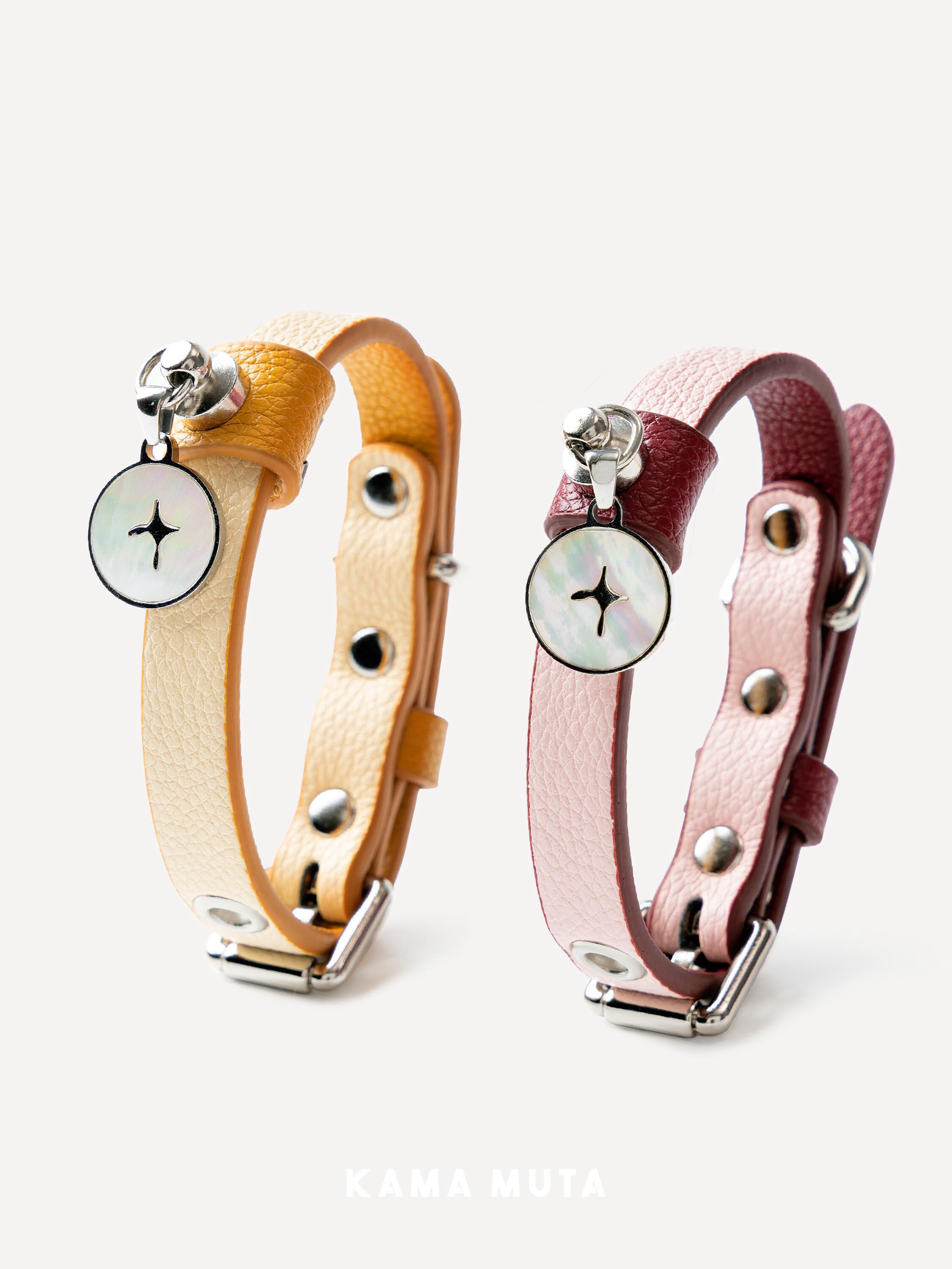 Two designer leather dog collars displayed side by side, featuring different color combinations and metal details
