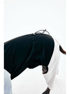 Adjustable back waist detail on a dog raincoat for a secure and flexible fit