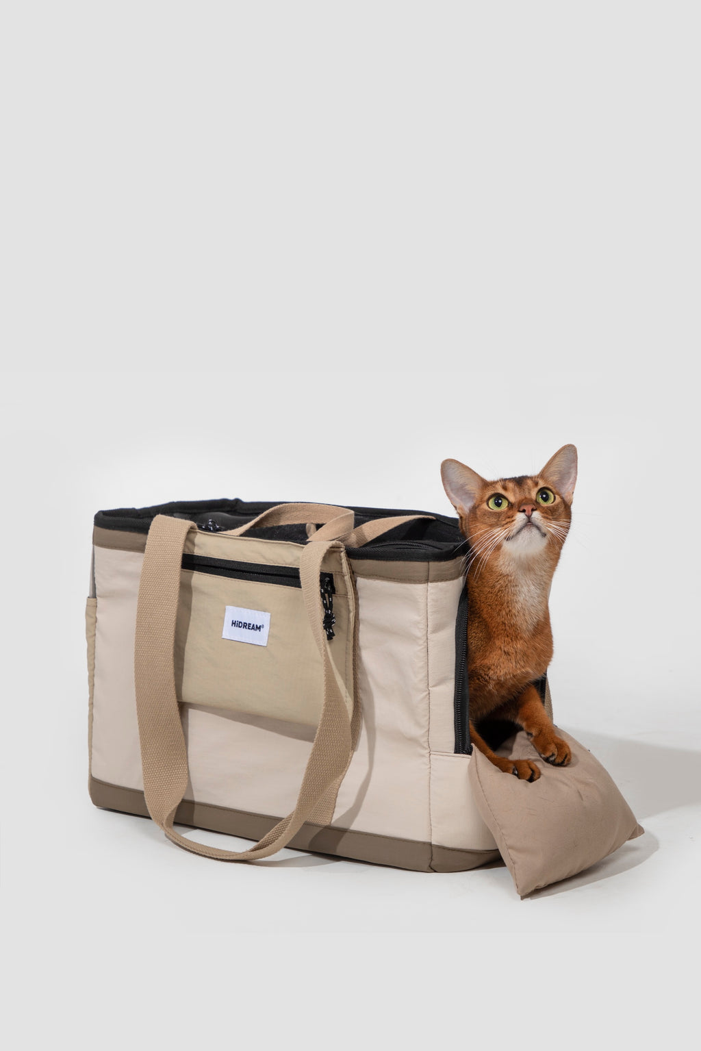 Dog tote bag with side opening and padded step, allowing the pet to enter and rest comfortably while staying partially outside.