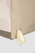 Side view of a dog tote bag with built-in waste bag dispenser, allowing quick access to bags during walks or outings.