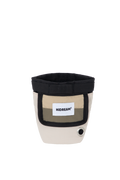 Front view flat lay of a beige dog treat pouch, showing the magnetic opening edge, front label panel, and bottom waste bag dispenser hole.