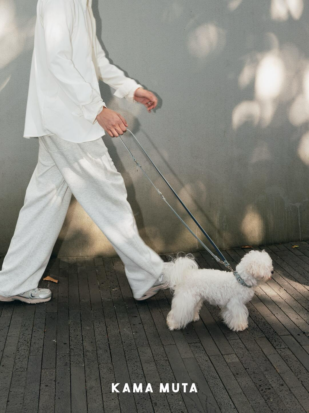 Minimalist leather dog leash in use during an everyday walk, highlighting flexibility and comfortable length
