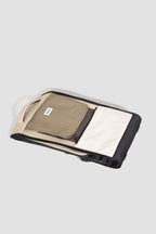 Foldable pet carrier backpack shown folded flat, demonstrating compact storage and the collapsible structure.