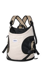 Beige front-facing cat carrier with breathable mesh side panels, structured bottom, and adjustable shoulder straps