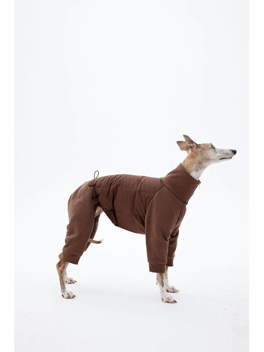 Side view of a dog wearing a full-body four-leg winter jacket