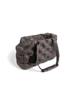 Minimal gray pet carrier bag featuring a soft padded structure for comfortable transport of small dogs.