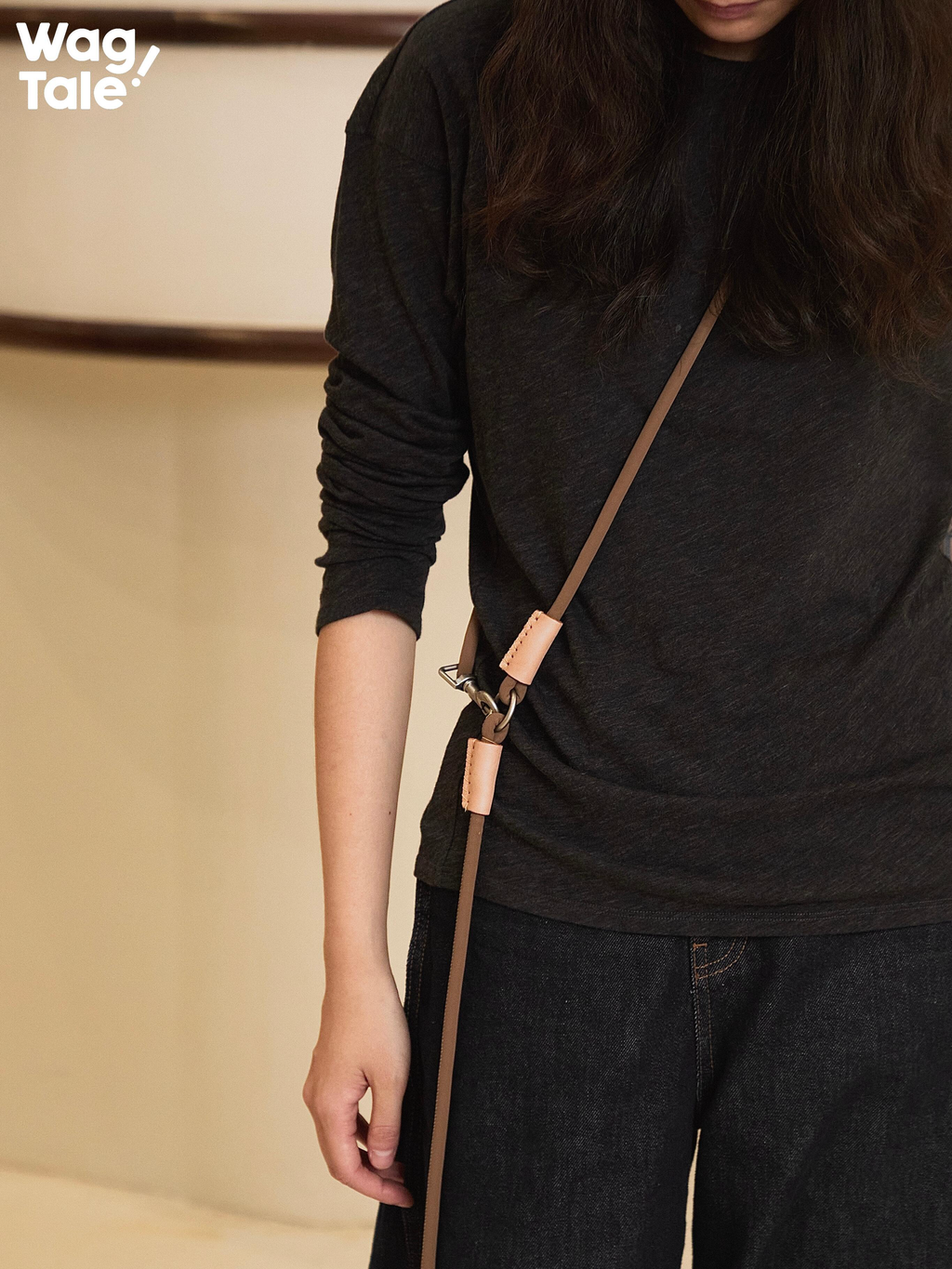 Close-up of a hands-free crossbody dog leash showing adjustable alloy hardware, leather trim details, and clean minimalist design.