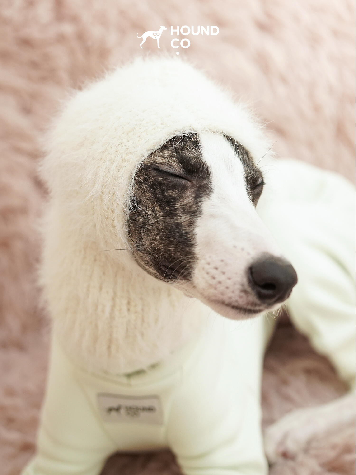 Cream knitted dog balaclava hood from Hound Co., providing ear protection and winter warmth for small to medium dogs.
