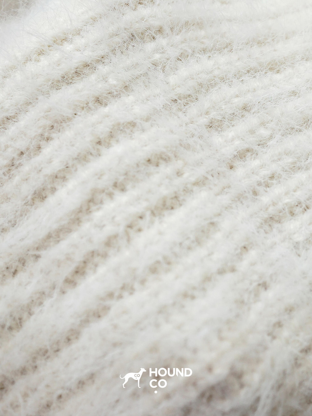 Hound Co.'s collection of fuzzy knit snoods in mustard yellow, cobalt blue, and ivory, displayed to showcase color options for sighthound owners.