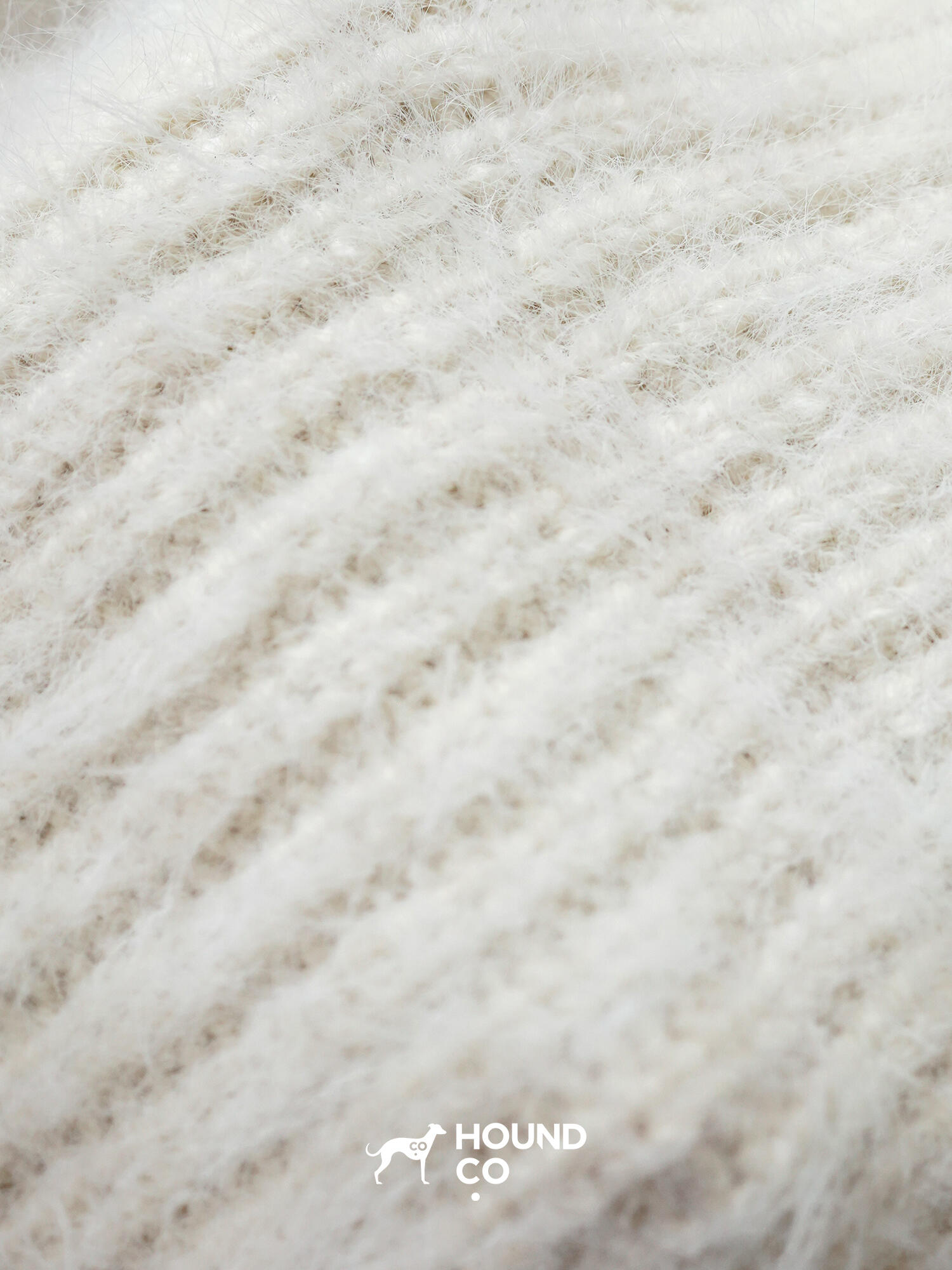 Hound Co.'s collection of fuzzy knit snoods in mustard yellow, cobalt blue, and ivory, displayed to showcase color options for sighthound owners.