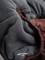 Macro view of the fleece interior fabric used inside a winter dog suit, showing thickness and softness